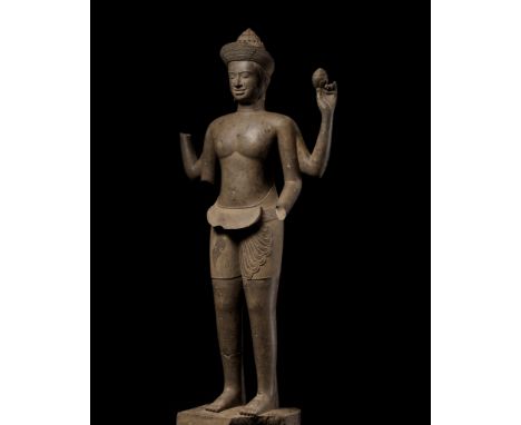 AN EXTREMELY RARE AND MONUMENTAL SANDSTONE STATUE OF VISHNU, ANGKOR PERIODKhmer Empire, 10th-12th century. The Preserver of t