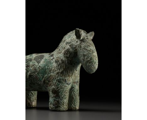 A RARE BRONZE HORSE-FORM VESSEL, DONG SON CULTURENorthern Vietnam, 2nd century BC to 2nd century AD. Well cast standing on al