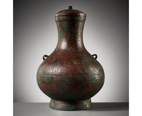 A COPPER-INLAID BRONZE RITUAL WINE VESSEL AND COVER, HU, EASTERN ZHOU DYNASTY 東周錯銅蓋壺Expert's note: For further research and a