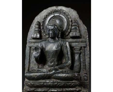 A BLACK SCHIST STELE OF BUDDHA SHAKYAMUNI, PALA PERIODNortheastern India, Bihar, 10th century. Well carved seated in dhyanasa