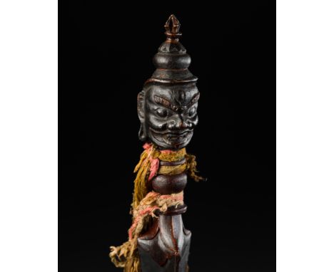 A LACQUERED WOOD PHURBU, MONGOLIA, 19TH CENTURYFinely carved from a single piece of wood and covered with a rich varnish, the