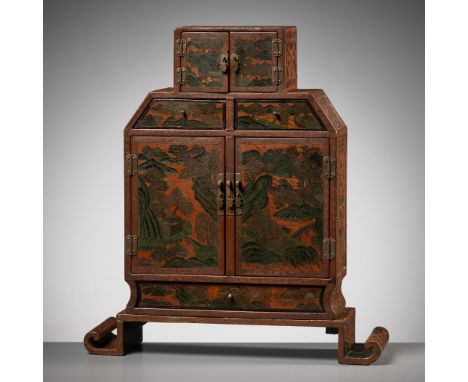 A TIANQI AND QIANGJIN LACQUER CABINET, QIANLONG TO JIAQING PERIOD 乾隆至嘉慶時期戧金填漆開光櫃China, 1736-1821. The rectangular cabinet sup