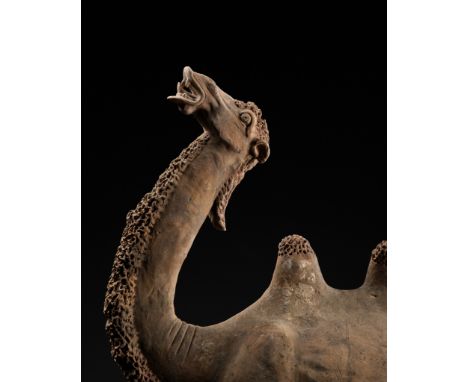 A LARGE PAINTED POTTERY FIGURE OF A BACTRIAN CAMEL, TANG DYNASTY 唐代彩繪駱駝俑China, 618-907. Well modeled standing foursquare, the