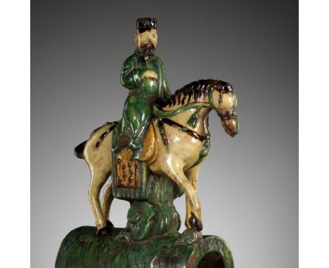 A SANCAI GLAZED EQUESTRIAN-FORM ROOF TILE, MING DYNASTY 明代三彩琉璃瓦China, 1368-1644. A well modeled dignitary depicted on an arch