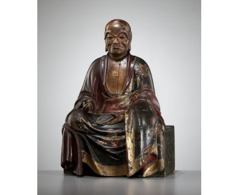 A LACQUERED WOOD FIGURE OF A RAKAN (ARHAT)Japan, c. 1700, Edo period (1615-1868)The rakan seated in dhyanasana on a rectangul