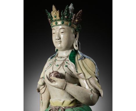 A LARGE FAMILLE VERTE BISCUIT FIGURE OF AMITAYUS, KANGXI PERIOD 康熙大型素三彩無量壽佛立像China, 1662-1722. Well modeled standing, dressed