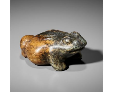 A LARGE GREEN AND RUSSET JADE FIGURE OF A THREE-LEGGED TOAD, MING DYNASTY 明代大型三足玉蟾China, 1368-1644. The pebble boldly carved 