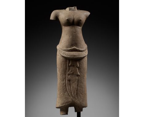 A SANDSTONE TORSO OF A FEMALE DEITY, ANGKOR PERIOD, BAYON STYLEKhmer Empire, 13th century. Finely sculpted standing in samabh