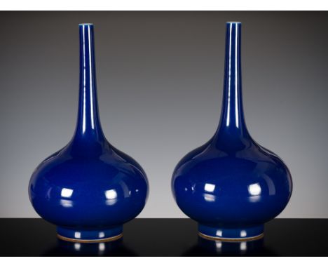 A LARGE PAIR OF BLUE-GLAZED BOTTLE VASES, LATE QING DYNASTY 清末一對藍釉長頸瓶China, 19th century. Each with a compressed globular bod