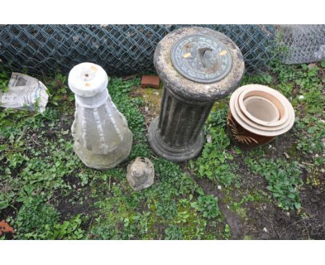 A BRASS SUNDIAL ON A COMPOSITE COLUMN, a composite base, four graduated brown glazed plant pots and a small figure of a fox (