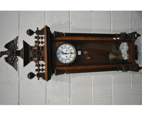 A 19TH CENTURY WALNUT CASED EIGHT DAY  GUSTAV BECKER WALL CLOCK, the pediment depicting an eagle, above a face, two finials, 