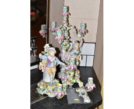 TWO EARLY 20TH CENTURY FOUR LIGHT FIGURAL CANDELABRA, Continental porcelain in need of restoration, all pieces with floral en