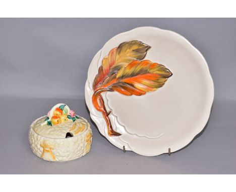 A CLARICE CLIFF FOR NEWPORT POTTERY CELTIC HARVEST PRESERVE JAR AND COVER, moulded and printed marks, diameter 11cm, together