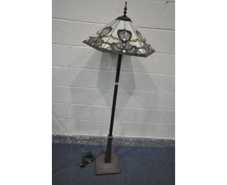 A METAL STANDARD LAMP, with a hexagonal Tiffany style shade, of foliate decoration, height 167cm (condition - loose shaft, wi