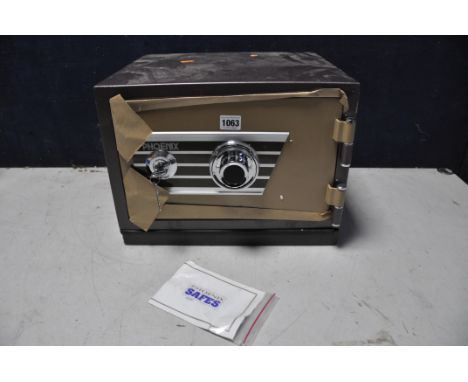 A PHEONIX SAFE model No unknown with two keys and code (in new unused condition)