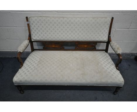 AN EDWARDIAN WALNUT AND INLAID SOFA, with swept open armrests, with floral upholstery, on turned legs, length 135cm (conditio