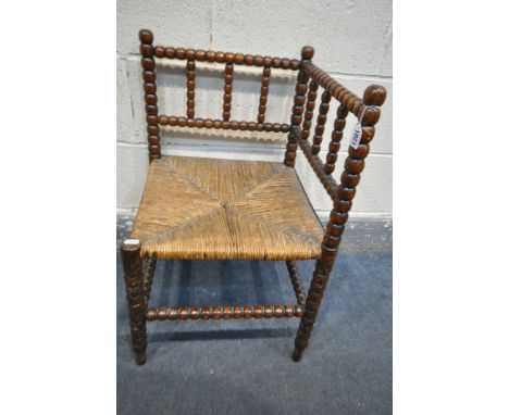 A VICTORIAN MAHOGANY BOBBIN TURNED CORNER CHAIR, with a rush seat, 42cm squared x height 68cm (condition - signs of wear and 