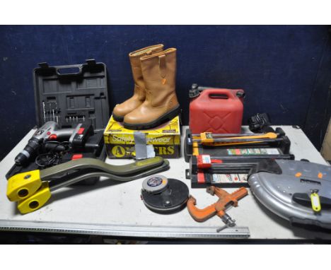 A SELECTION OF MISCELLANEOUS to include three steering locks, petrol can, two pairs of steel toe cap boots both (size 8), two