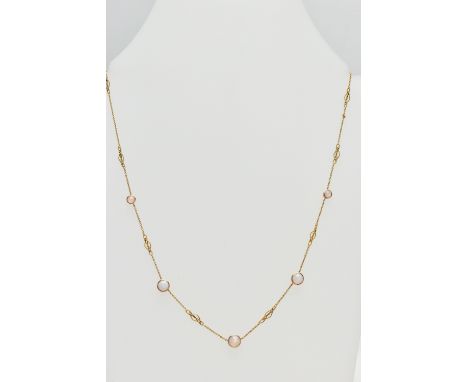 A YELLOW METAL OPAL NECKLACE, a fine rolo link chain with rope twist spacers, fitted with five circular cut opal cabochons ea