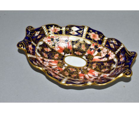 A ROYAL CROWN DERBY IMARI 2451 TRINKET DISH, of scalloped oval form with scrolling handles, magenta printed backstamp, length