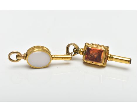 TWO WATCH KEYS, the first a yellow metal key set with an oval citrine and chalcedony panels, floral and scroll pattern unmark