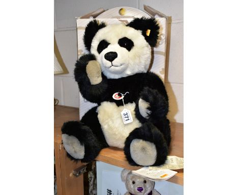 A BOXED STEIFF 'PANDA TED', black and white acrylic mix, jointed, yellow label, model no.010637, with paper tags attached, he