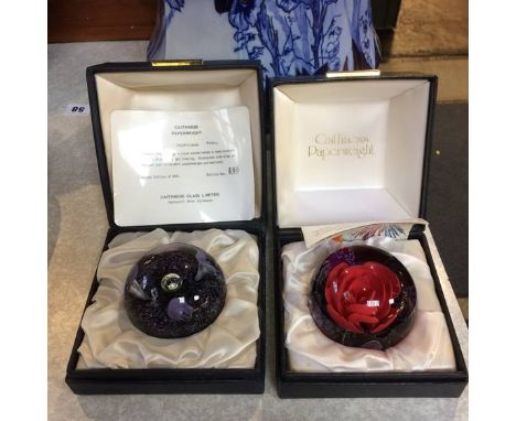 Two boxed Caithness paperweights