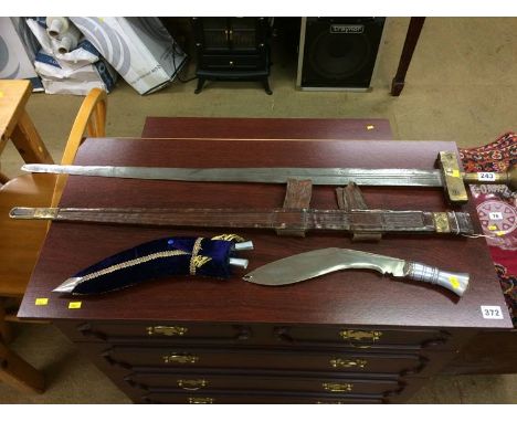 Sword with leather scabbard and a Kukhri