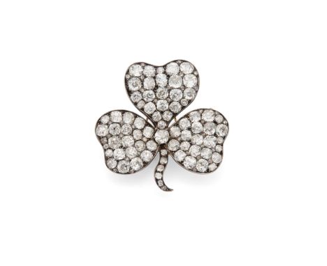 A diamond shamrock brooch, late 19th century The petals and stem pavé-set throughout with cushion-shaped, old brilliant and r