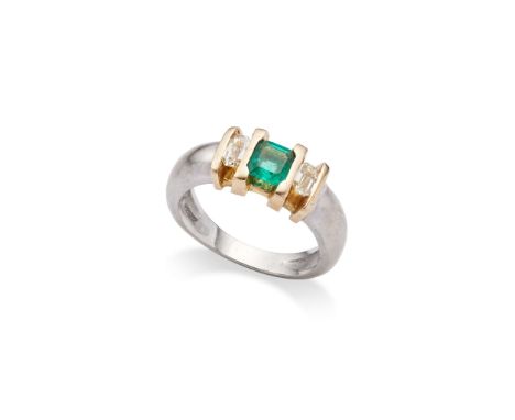  An emerald and diamond three-stone ring, 2000  Centrally-set with a square step-cut emerald, between cut-cornered step-cut d