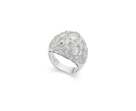  A white gold bombé diamond ring  Centrally collet-set with a brilliant-cut diamond, within a surround of brilliant, old bril