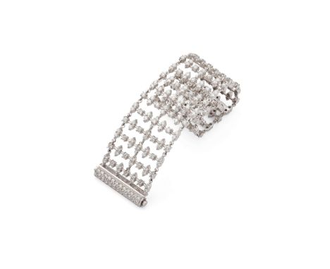 A wide diamond bracelet  Designed as an openwork series of baton links, set throughout with brilliant-cut diamonds, to an in