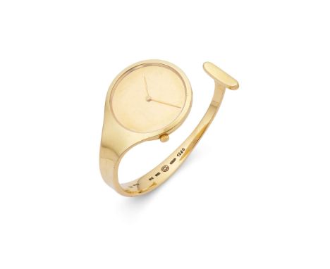  Georg Jensen: A gold "Vivianna Torun" watch, 1973  Of torc design, the 18 carat gold circular polished dial, tapering to a b