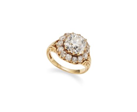  A cushion-shaped diamond cluster ring  Centrally featuring a cushion-shaped diamond, weighing 4.55 carats, within a border o