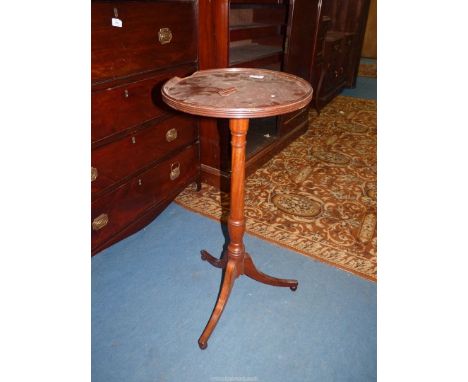 A Walnut/Mahogany circular wine/lamp table having turned pillar and three splay feet, top detached and chipped, 14 1/2" diame