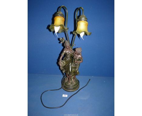 A contemporary art nouveau style Lamp with two maidens and two glass shades, 26" tall.