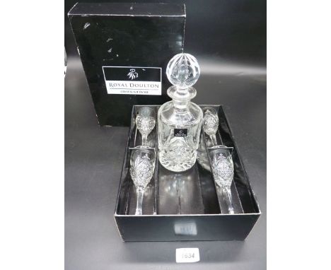 A boxed Royal Doulton crystal giftware to include four sherry glasses and a decanter.