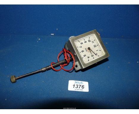 A Smith's clockwork square faced car dashboard clock having pendant winding/setting spindle, the grey face having Arabic nume