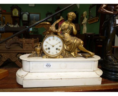An ornate Mantle clock depicting a seated lady with eagle on white polished stone base, some damage, 16" x 6" x 14".*