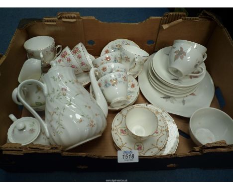 Part tea sets floral and leaf pattern including a Royal Albert milk jug,sugar basin and bowl a Wedgwood teapot with floral de