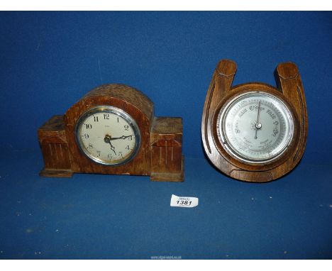 A lucky Horseshoe dark wood mounted Aneroid Barometer, 7 1/2'' high x 6 1/8'' wide together with a wooden cased Enfield faced