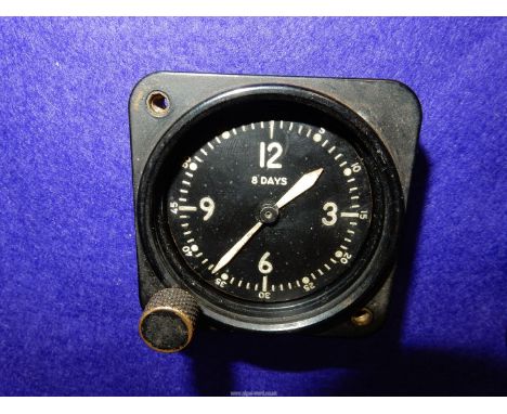 A black Bakelite military/aviation type dashboard Clock by the Bulova Watch Co., USA 21AE eight day pocket watch size movemen