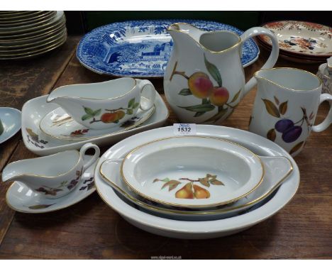 A quantity of Royal Worcester 'Evesham' china including large and medium size jugs, gravy and sauce boats, oval serving dishe