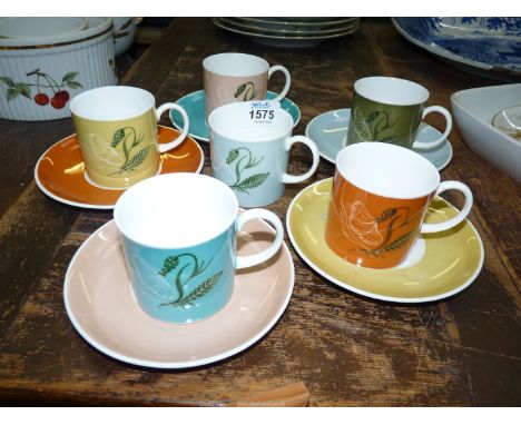 A part Susie Cooper coffee set of six coffee cans and five saucers.