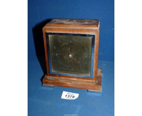 An oak cased brass faced mantel clock having Roman numerals and by H. Pidduck &amp; Sons Ltd, Hanley, French escapement, 5 3/