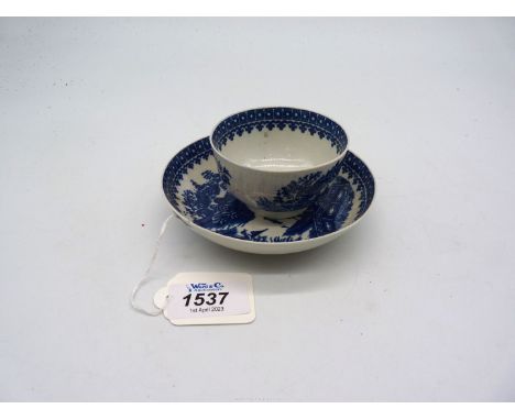 A Worcester Dr Wall tea bowl and saucer with crescent mark to base.