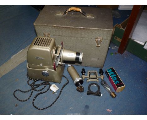 An Aldis slide projector in case with extension lens.