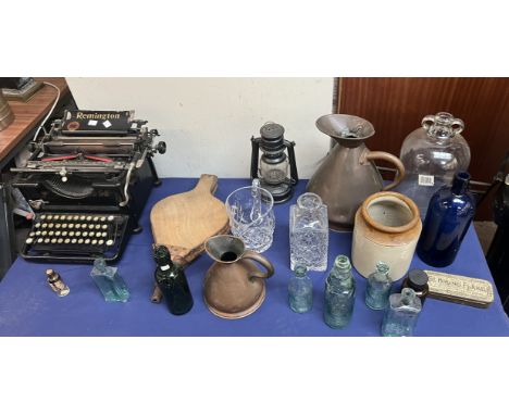 A Remington typewriter together with a demi John, jugs, bellows etc 