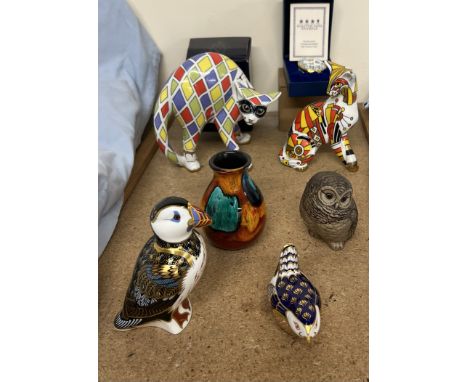 A Royal Crown Derby paperweight in the form of a Puffin together with another of a wren, a Halcyon days enamel box and cover,