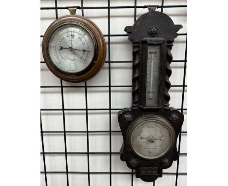 An oak cased Negretti and Zambra aneroid barometer with a mercury thermometer together with another Negretti and Zambra barom